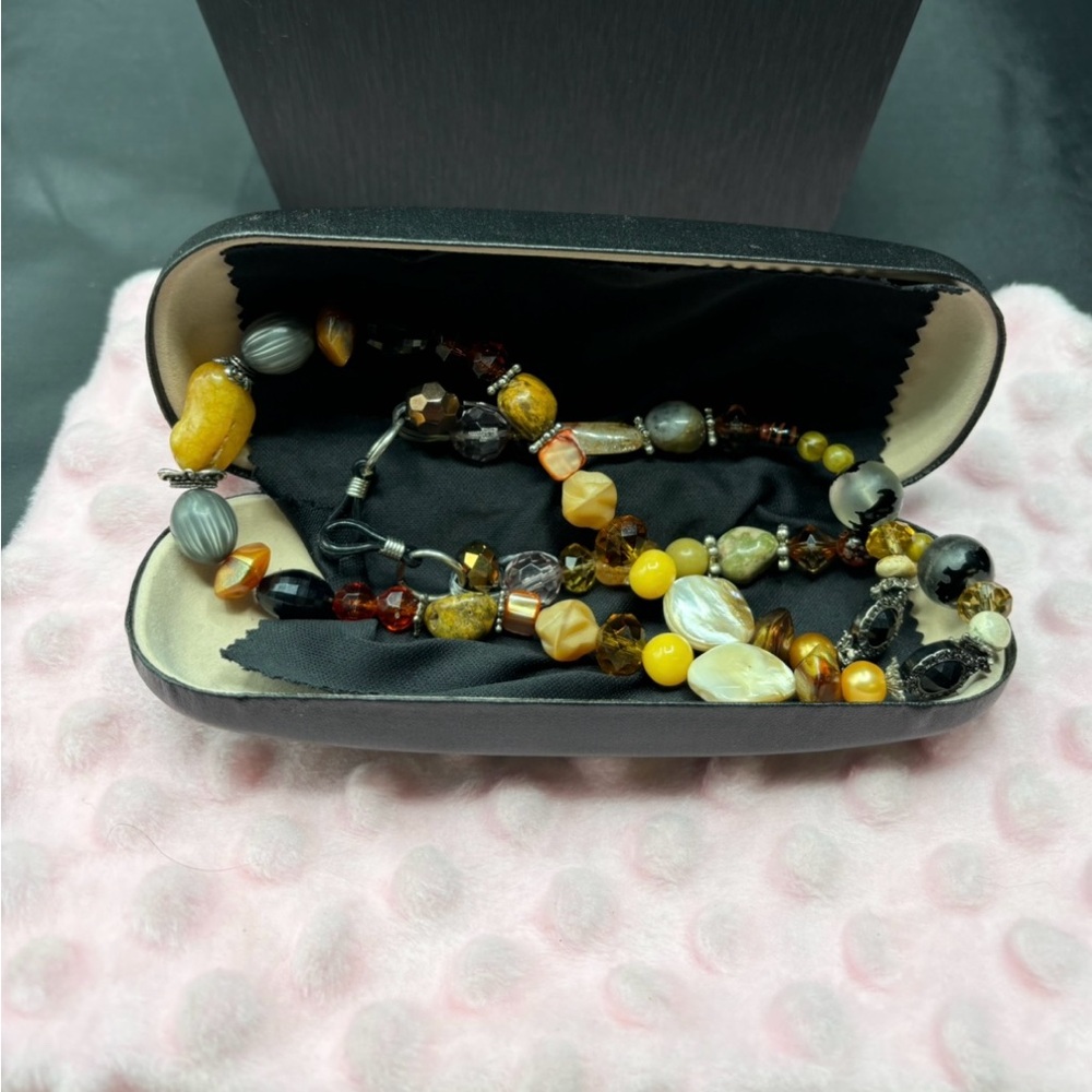 Handcrafted by Evi Vaucher de la Croix..genuine stones hold your glasses
